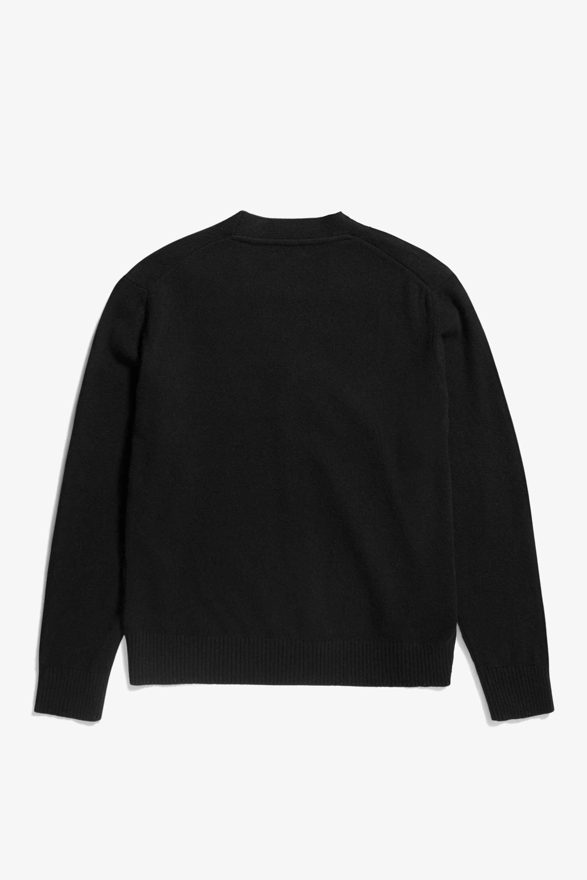Cardigan - confectionné en Italie, avec manches montées, des côtes 2x2 simples à l'ourlet et aux poignets, une patte à cinq boutons et une étiquette siglée à l'ourlet.